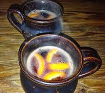 Hot mulled wine with orange slices