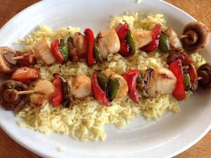 Scallop kebob over bed of rice